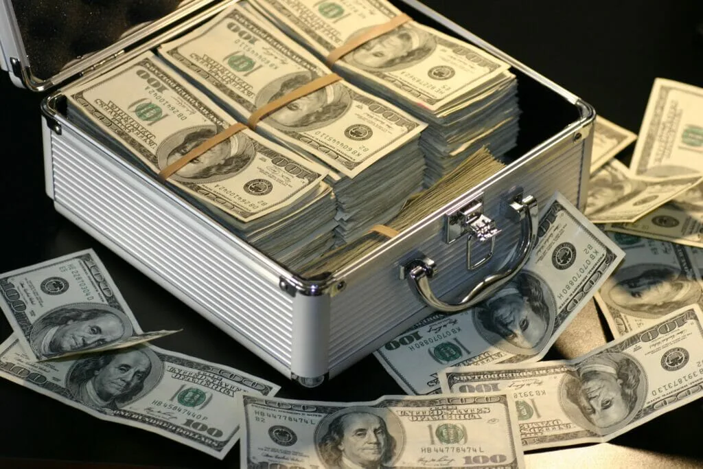 Grey metal case of hundred dollar bills
